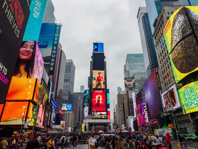 Capture of bustling Times Square with bright advertisements in New York, USA. What programmatic advertising operations means for delivery teams