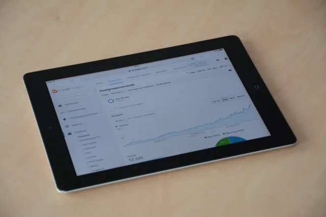 A digital tablet showing a web analytics dashboard with graphs and charts. Programmatic advertising UK regulations: PECR consent, UK GDPR lawful basis and the ICO children's code